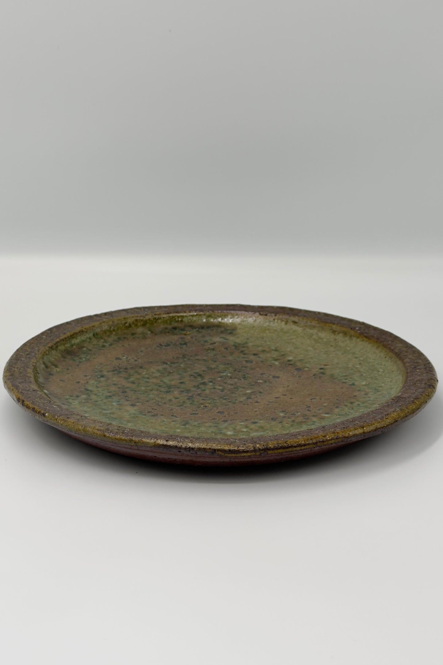 Yachimun Plate – Sage Green & Rust Glaze with Rock-Textured Rim by Paul Lorimer (019-PL)
